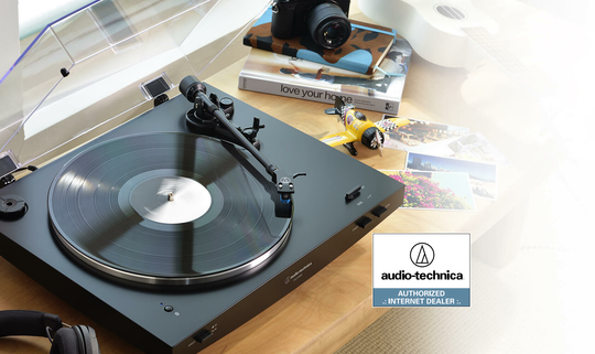 Audio-Technica turntable next to Audio-Technica headphones